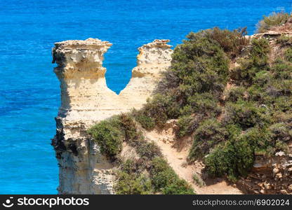 Picturesque seascape with white rocky cliffs at Grotta dello Mbruficu, Salento Adriatic sea coast, Puglia, Italy.