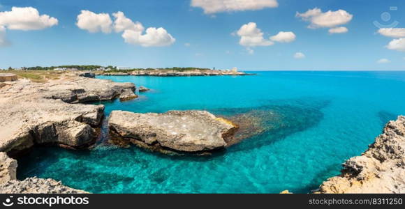 Picturesque seascape with white rocky cliffs, caves, sea bay and islets at Grotta della poesia, Roca Vecchia, Salento Adriatic sea coast, Puglia, Italy