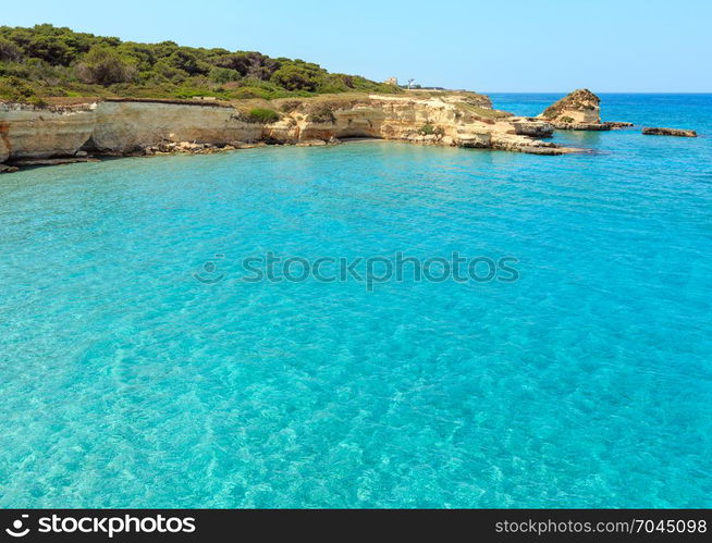 Picturesque seascape with white rocky cliffs, sea bay, islets and faraglioni at beach Spiaggia della Punticeddha, Salento Adriatic sea coast, Puglia, Italy