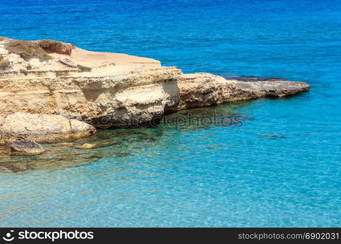 Picturesque seascape with white rocky cliffs (Spiaggia della Punticeddha, Salento, Adriatic sea coast, Puglia, Italy)