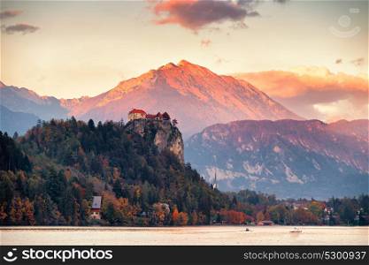 Picturesque Slovenia, Bled lake and town at sunset. Amazing View On Bled Lake, Island, Church And Castle With Mountain Range (Stol, Vrtaca, Begunjscica). Slovenia, Europe