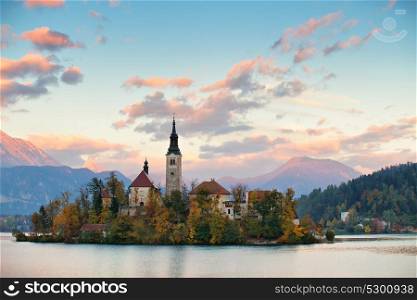 Picturesque Slovenia, Bled lake and town in the evening. Amazing View On Bled Lake, Island, Church And Castle With Mountain Range (Stol, Vrtaca, Begunjscica). Slovenia, Europe