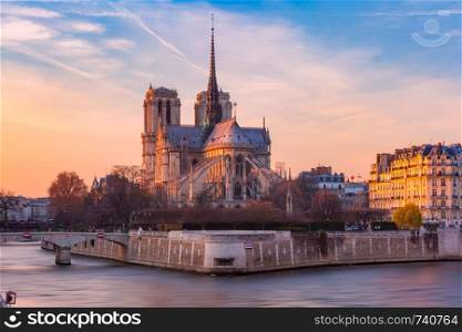 Picturesque sunset over Cathedral of Notre Dame de Paris, destroyed in a fire in 2019, Paris, France. Cathedral of Notre Dame de Paris at sunset, France