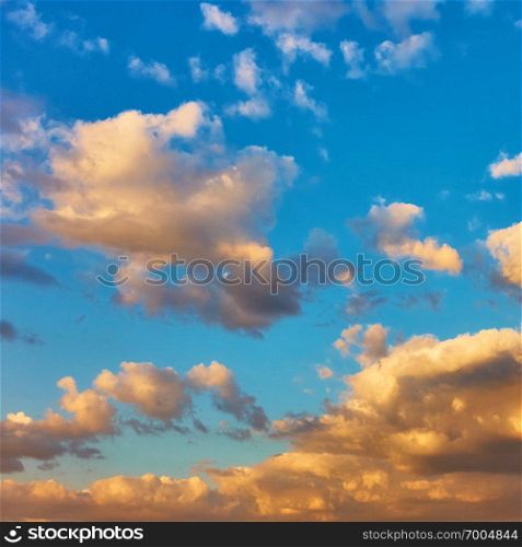 Picturesque sunset sky with clouds, may be used as background. Square cropping