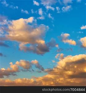 Picturesque sunset sky with clouds, may be used as background. Square cropping