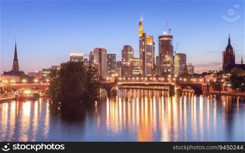 Picturesque sunset view of the skyscrapers in the business part of the city. Frankfurt am Main. Germany.. Skyscrapers in Frankfurt am Main against the backdrop of the river at sunset.