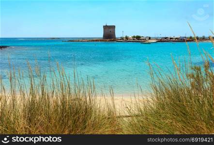 Picturesque Torre Chianca beach and historical fortification tower Torre Chianca (Torre Santo Stefano) on Salento Ionian sea coast, Porto Cesareo, Puglia, Italy