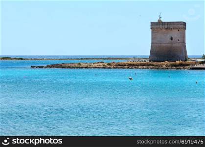 Picturesque Torre Chianca beach and historical fortification tower Torre Chianca (Torre Santo Stefano) on Salento Ionian sea coast, Porto Cesareo, Puglia, Italy
