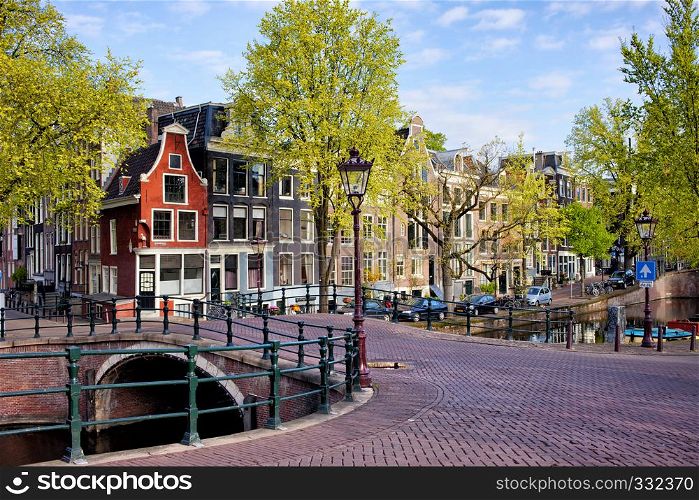 Picturesque traditional Dutch houses and bridge on the Reguliersgracht canal in Amsterdam, Holland, Netherlands.