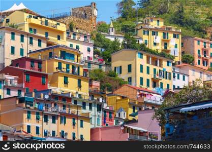 Picturesque view of colorful houses in Riomaggiore fishing village in Five lands, Cinque Terre National Park, Liguria, Italy.. Picturesque view of Riomaggiore, Liguria, Italy