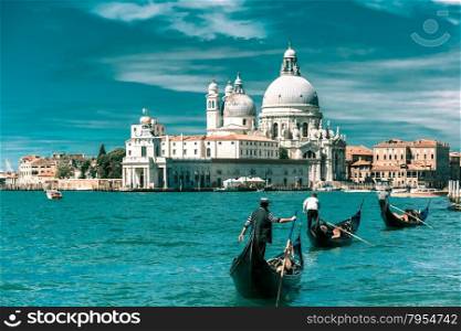 Picturesque view of Gondolas on Canal Grande with Basilica di Santa Maria della Salute in the background, Venice, Italy. Toning in cool tones