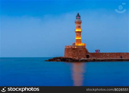 Picturesque view of Lighthouse in old harbour of Chania during twilight blue hour, Crete, Greece