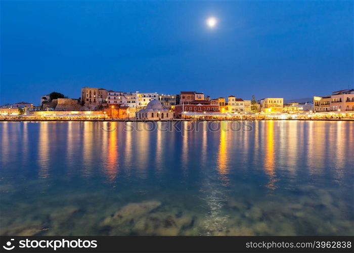 Picturesque view of Venetian quay of Chania with Kucuk Hasan Pasha Mosque during twilight blue hour, Crete, Greece