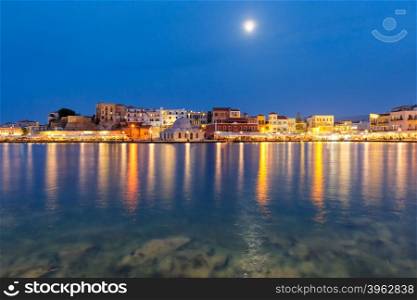 Picturesque view of Venetian quay of Chania with Kucuk Hasan Pasha Mosque during twilight blue hour, Crete, Greece