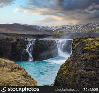 Picturesque waterfall Sigoldufoss autumn view. Season changing in southern Highlands of Iceland.