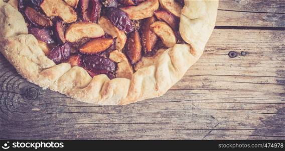 Pie in summer: Plum cake on rustic wooden table