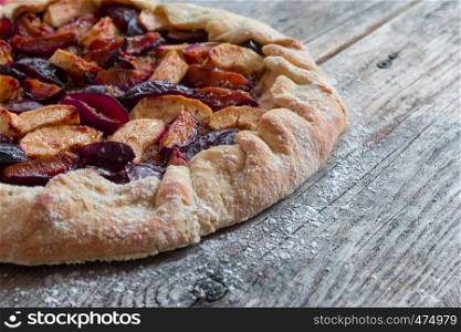 Pie in summer: Plum cake on rustic wooden table