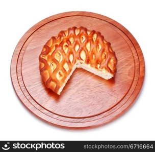pie with curds on wooden tray, isolated on white