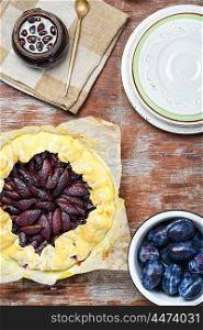 Pie with plums. Rustic pie with autumn plum.The view from the top