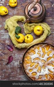 Pie with quinces. aromatic tea in hand and pie with autumn quince