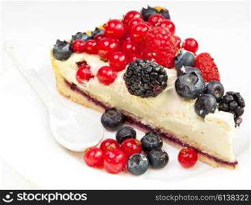 Piece of a pie with fresh berries