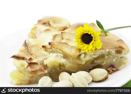 piece of apple pie and a flower isolated on white