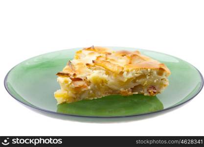 piece of apple pie on a plate isolated on white