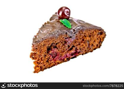 Piece of chocolate cake with cherries and mint isolated on white background