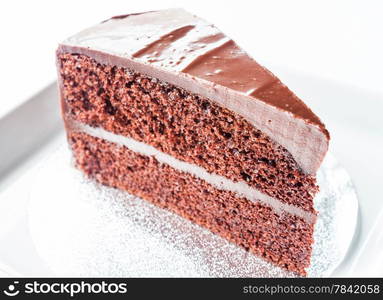 Piece of chocolate chiffon cake on white plate