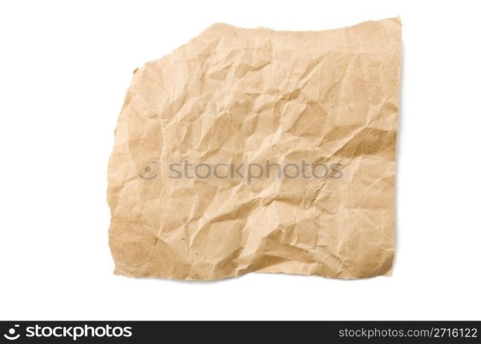 Piece of crushed brown paper isolated on white background with shadow