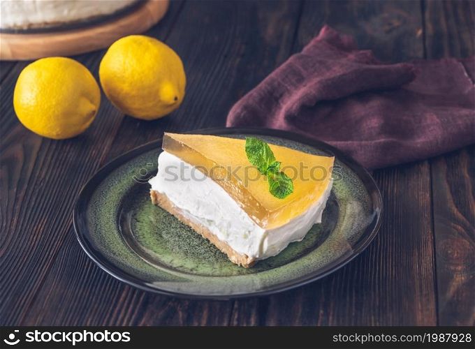 Piece of gin and tonic lemon cheesecake on rustic background