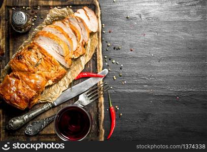 piece of grilled meat with red wine. On the black chalkboard.. piece of grilled meat with red wine.