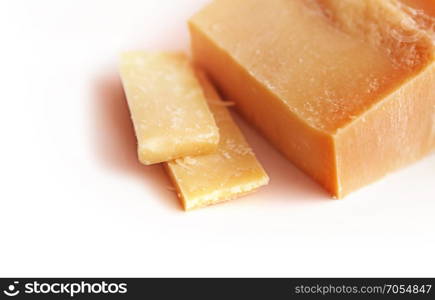 piece of Italian cheese parmesan on white background