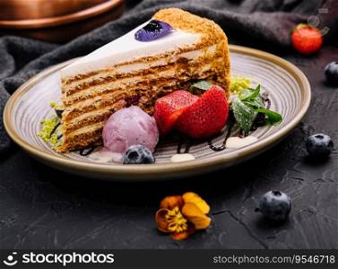 piece of multi-layered cake decorated with mixed berries
