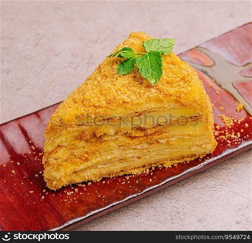 piece of Napoleon Cake on red plate