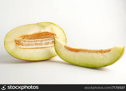 piece of ripe melon with seeds on a white background, summer sweet fruit