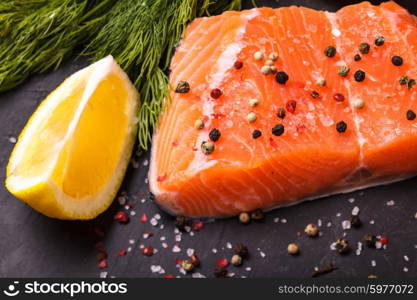 Piece of salmon with spices and lemon. Piece of salmon