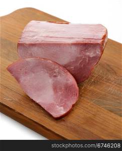 Piece Of Sliced Ham On A Cutting Board