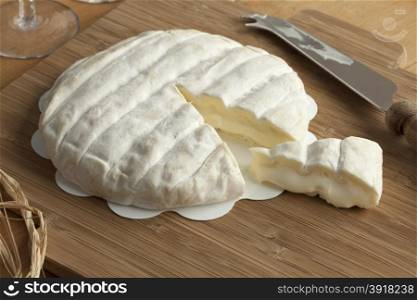 Piece of soft Italian Tuma dla Paja cheese