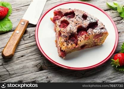 Piece of tasty homemade strawberry pie on a plate. Slice of tasty homemade strawberry tart