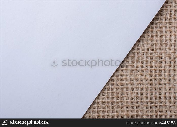 Piece of white paper placed on a linen canvas