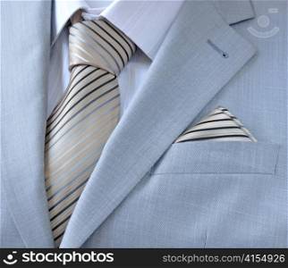 piece suit with white shirt, tie, scarf, close-up.