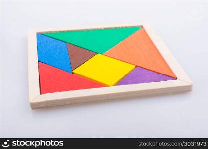 Pieces of a square tangram puzzle. Colorful pieces of a square tangram puzzle