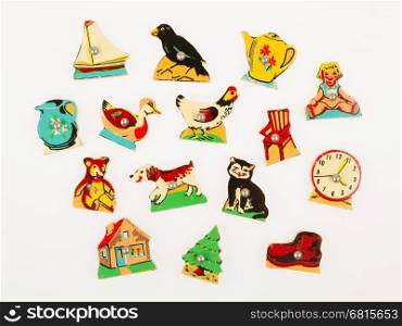 Pieces of an antique wooden puzzle for children leaning illustrations (1970)