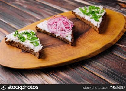 pieces of bread with delicious lard with red and green onions