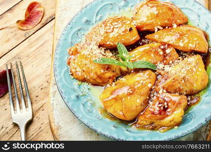 Pieces of caramelized persimmon.Autumn dessert sweetness, caramelized persimmon.. Appetizing caramelized persimmon.