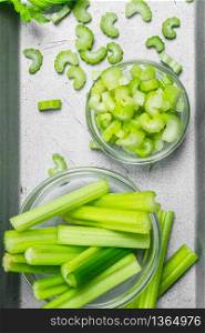 Pieces of celery in a bowl on a tray. Top view. Pieces of celery in a bowl on a tray.
