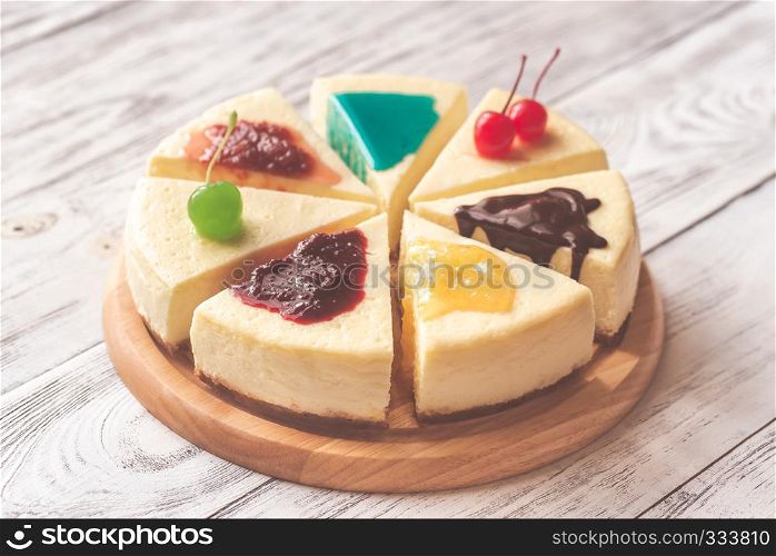 Pieces of cheesecake with different toppings