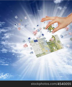 pieces of euro banknote puzzle getting together