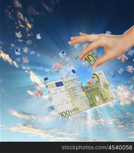 pieces of euro banknote puzzle getting together